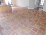 Mexican Saltillo paver tile with water damage and calcium deposits.