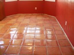 Mexican Saltillo paver tiles completely stripped to bare tile, acid washed and sealed with high gloss sealer / polish.